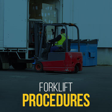 A warehouse worker loading a trailer with a forklift