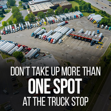 Aerial view of trucks parked at a truck stop