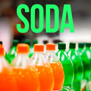 Rows of orange and green soda bottles
