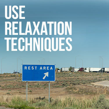 A sign next to a highway that says "rest area"